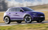 Purple Abarth 600e drifting   front three quarters